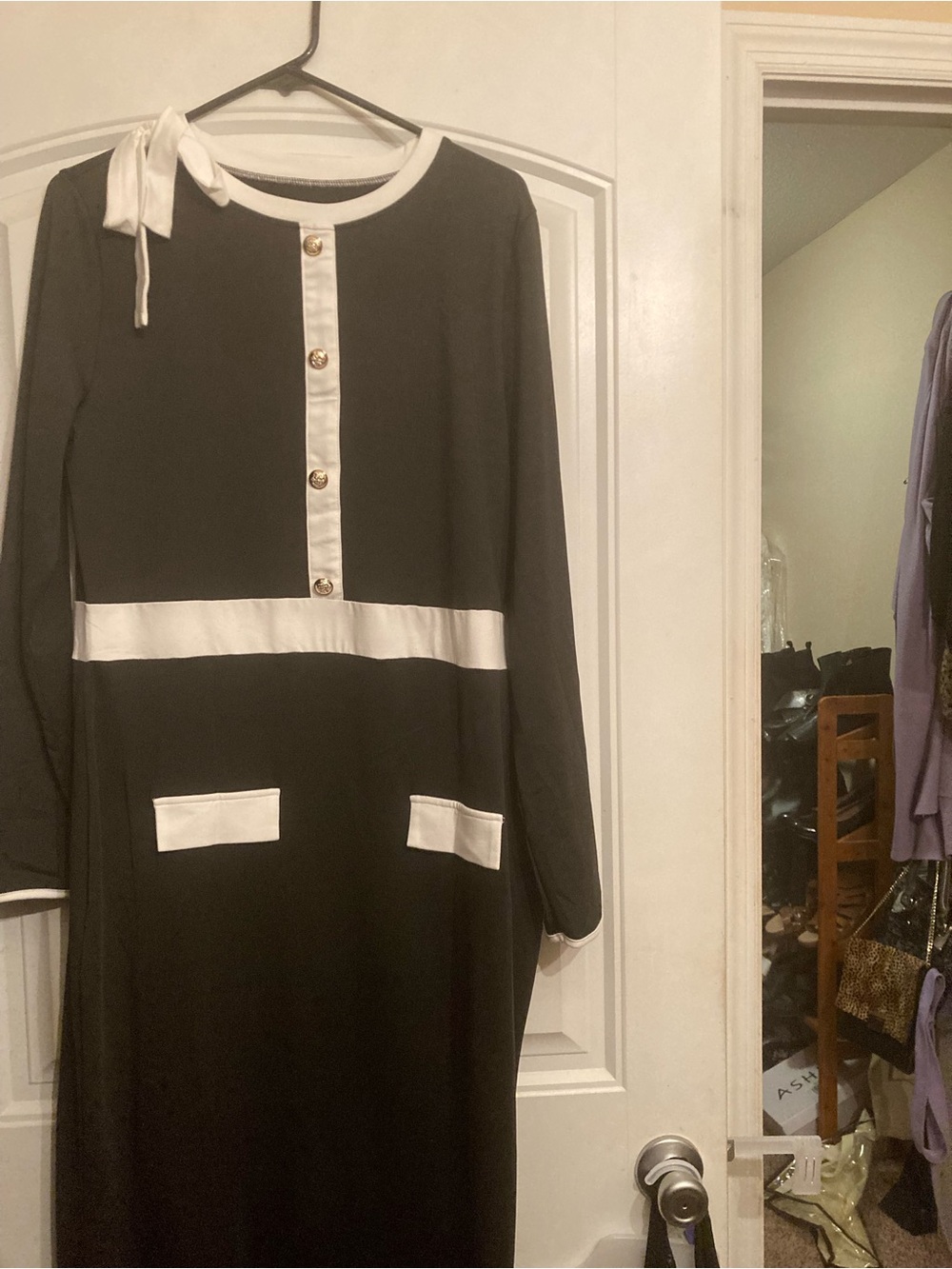Elegant Black Maxi Dress with White Trim and Bow Detail